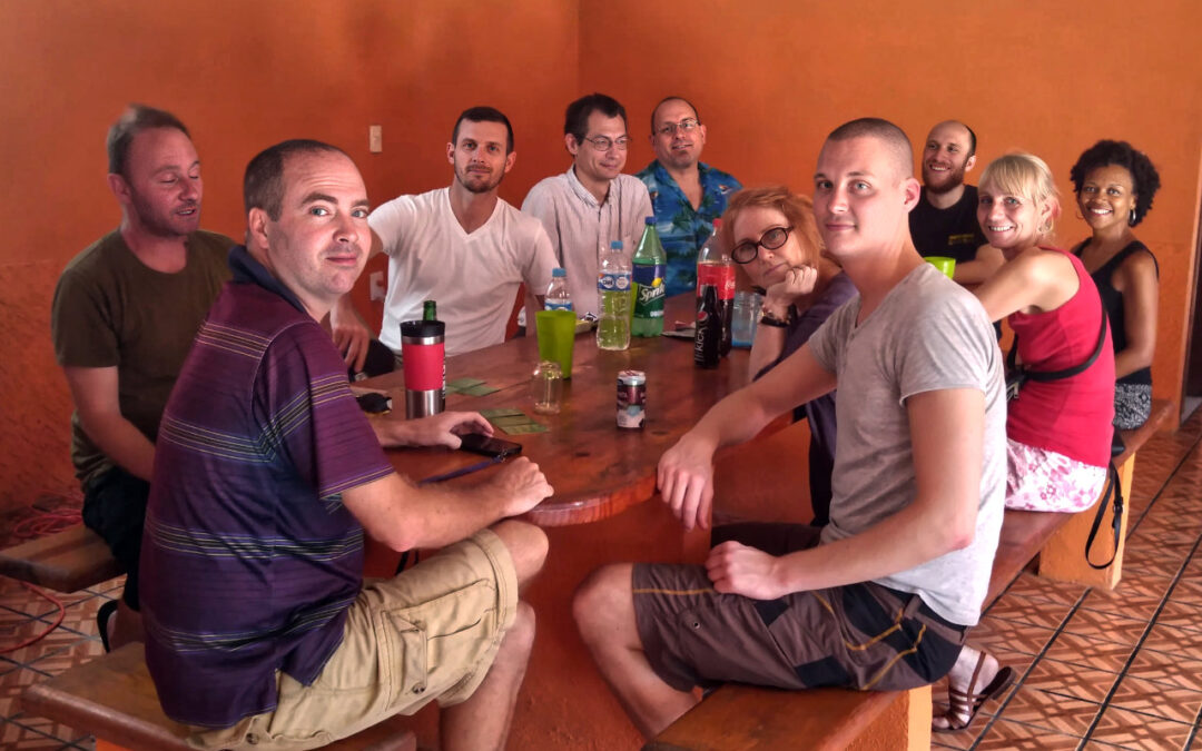 Group of people sitting at a table indoors.
