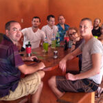 Group of people sitting at a table indoors.